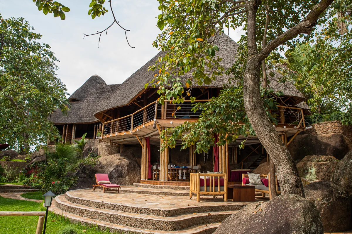 The open lounge terrace and stone steps set among boulders and tropical garden