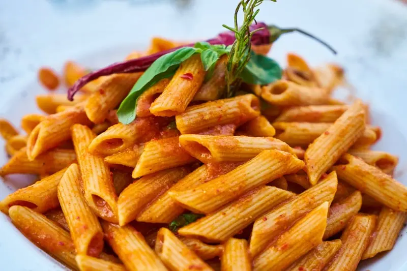 Penne in a rich tomato sauce, finished with basil